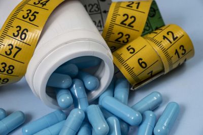 Close-up of pills on white background