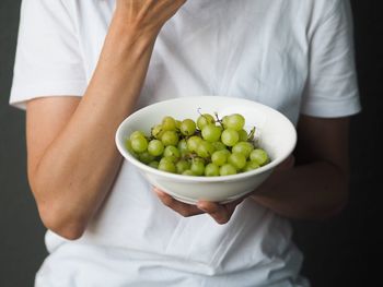 Midsection of man holding food