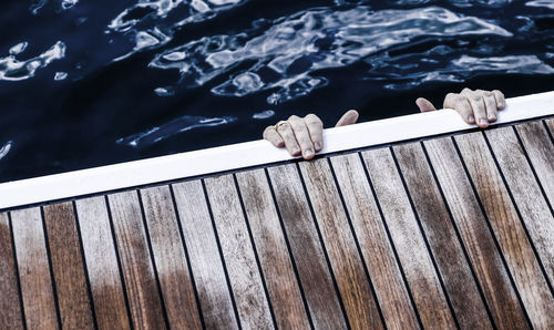 High angle view of person hanging from jetty