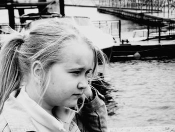 Close-up of girl with boat in water