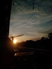 Scenic view of sunset seen through car window