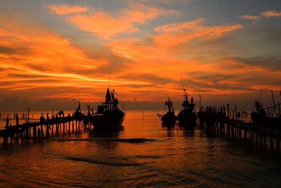 Scenic view of sea against orange sky