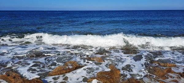 Scenic view of sea against clear sky