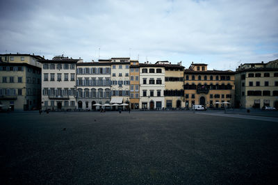 Buildings in city against sky