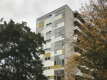 Low angle view of office building against sky