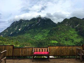 Scenic view of mountains against cloud sky