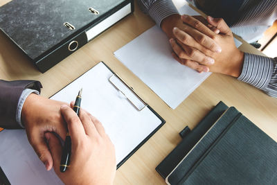 High angle view of man working on table