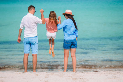 Rear view of women on beach