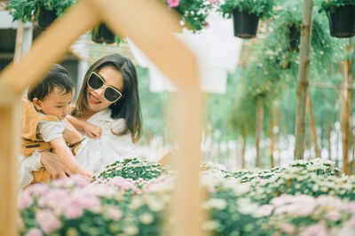 Woman with flowers on plants