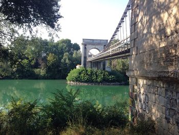 Bridge over river with buildings in background