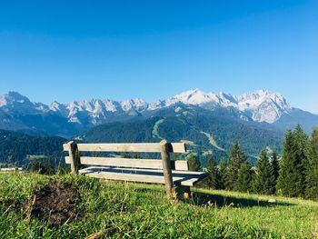 Scenic view of mountains against clear blue sky