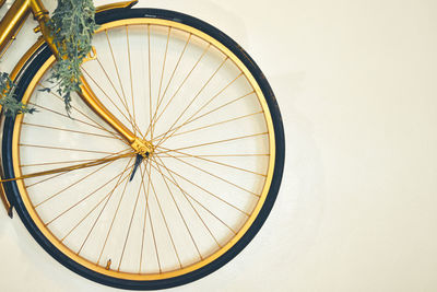 High angle view of bicycle wheel against wall