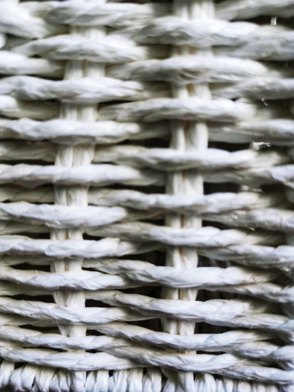 FULL FRAME SHOT OF WICKER BASKET ON METAL