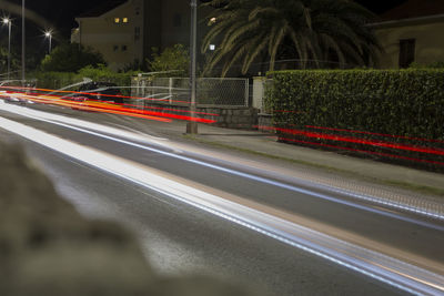 Light trails on street in city at night