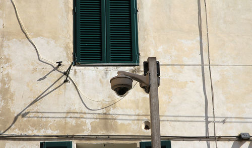 Low angle view of window of old building