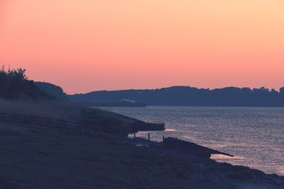 Scenic view of sea against clear sky during sunset