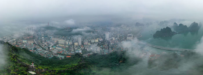 Aerial view of townscape against sky