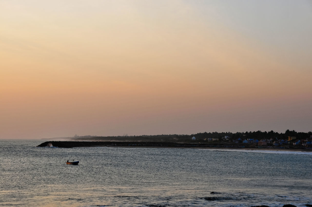 water, sky, sea, sunset, horizon, beauty in nature, shore, scenics - nature, nature, ocean, tranquility, beach, land, dawn, wave, body of water, tranquil scene, coast, no people, evening, travel destinations, nautical vessel, outdoors, idyllic, travel, horizon over water, transportation, cloud, orange color, environment, non-urban scene, seascape, sun, bay, tourism, holiday, sunlight