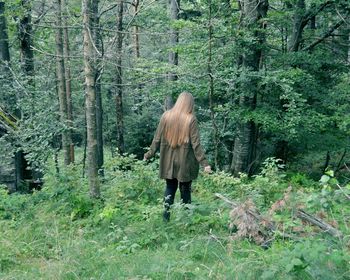 Rear view of woman in forest