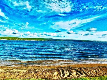 Scenic view of sea against cloudy sky