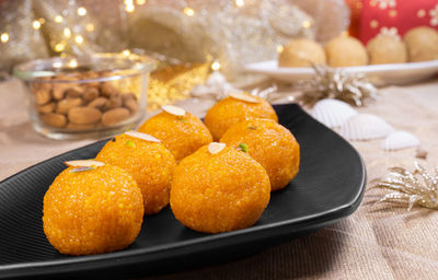 Close-up of fruits in plate on table