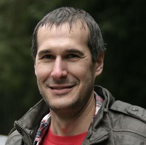 Portrait of wet man smiling outdoors