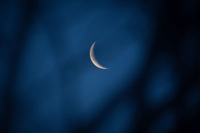 Low angle view of full moon in sky