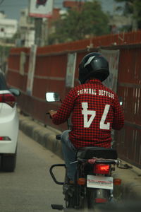 Rear view of man on road