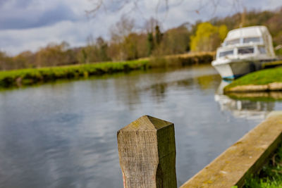 Wooden posts in lake