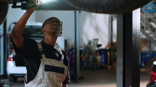 Side view of man exercising in gym