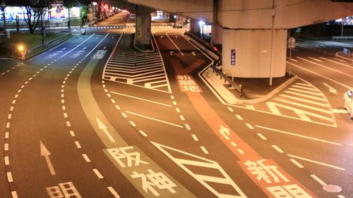 High angle view of light trails on road at night