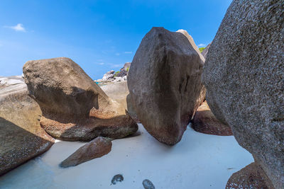 Rock formation against sky during winter