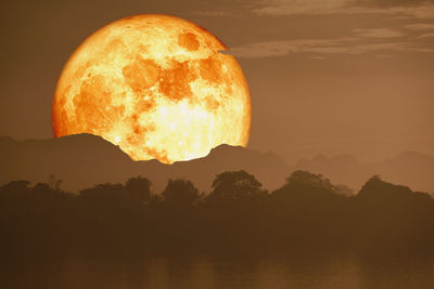 Blood moon back silhouette mountain on cloud and night sky, elements of this image furnished by nasa