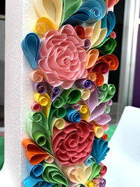 Close-up of multi colored flowers on table