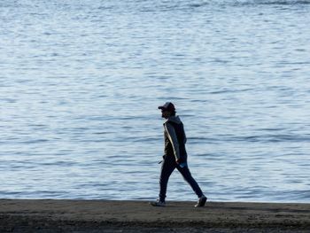 Full length of woman standing in water