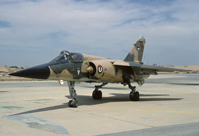 Military airplane on airport runway