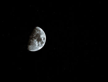 Low angle view of moon against sky at night