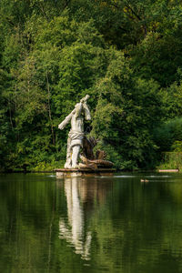 View of hercules statue in neuwerkgarten in gottorf castle in schleswig, germany.