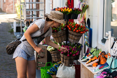 Woman working in basket at market stall