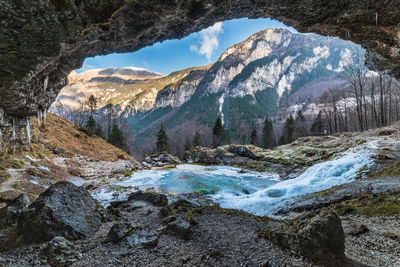 Winter. ice games in the fontanon of goriuda waterfall. friuli, italy.