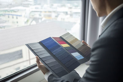 Close-up of a man holding window