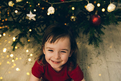 Cheerful child girl waiting for merry christmas and miracles