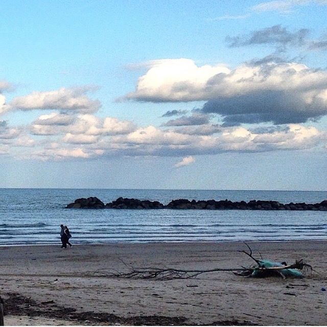 sea, horizon over water, sky, water, beach, transportation, cloud - sky, mode of transport, scenics, beauty in nature, shore, men, nautical vessel, tranquil scene, tranquility, nature, leisure activity, cloud