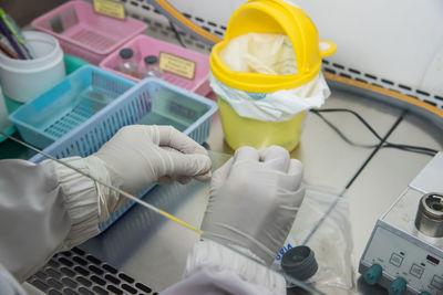 Midsection of scientist working in laboratory