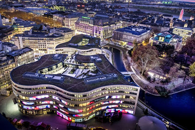 High angle view of illuminated buildings in city