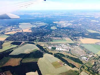 Aerial view of cityscape seen through airplane window