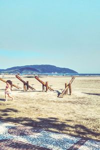 Scenic view of beach against blue sky