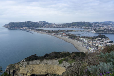 Panoramic view of sea and city against sky