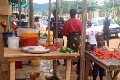 Rear view of people at market stall