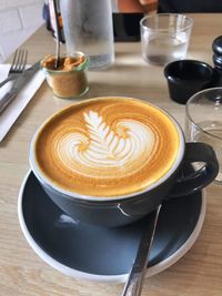 Close-up of cappuccino on table